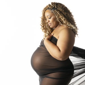 Gorgeous mama wears flowing fabric to showcase her beautiful pregnancy. Charlotte NC maternity photographer, 