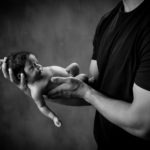 in safe arms, newborn baby photography, black and white, Indian Land SC, Matthews NC