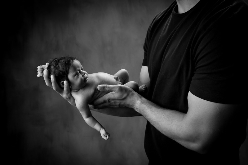 in safe arms, newborn baby photography, black and white, Indian Land SC, Matthews NC
