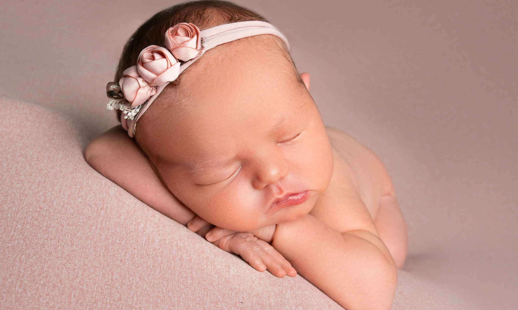 Newborn girl on pink. Charlotte Newborn Photographer