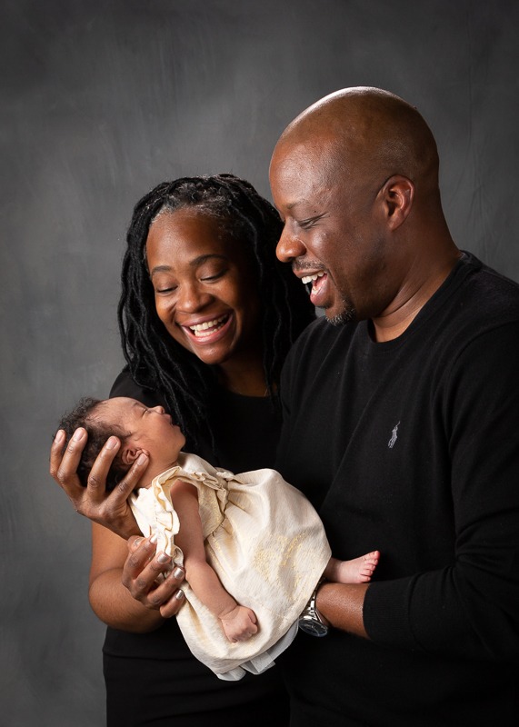 parents smiling at newborn baby girl, Charlotte NC, Matthews, NC