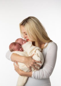 Mom holding her newborn twins