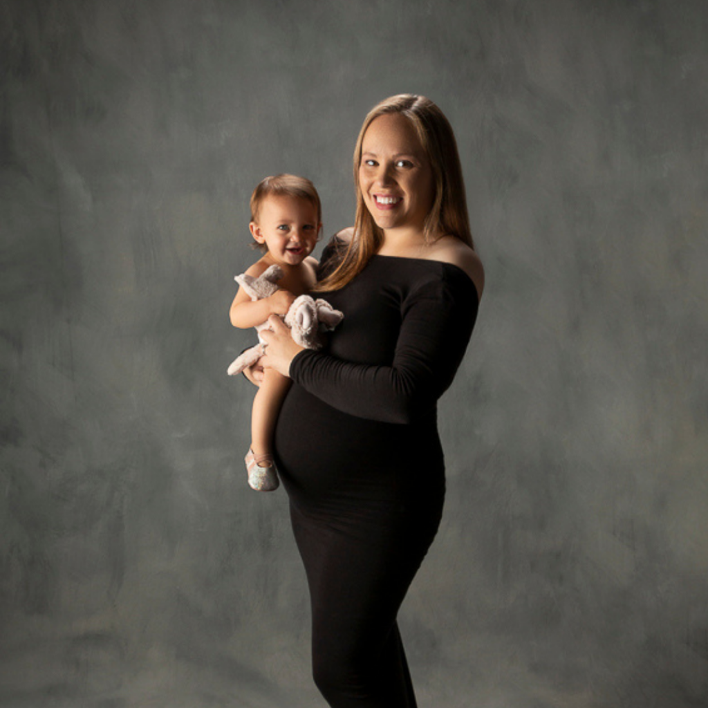 maternity pictures with toddlers and stuffies and smiles are so fun