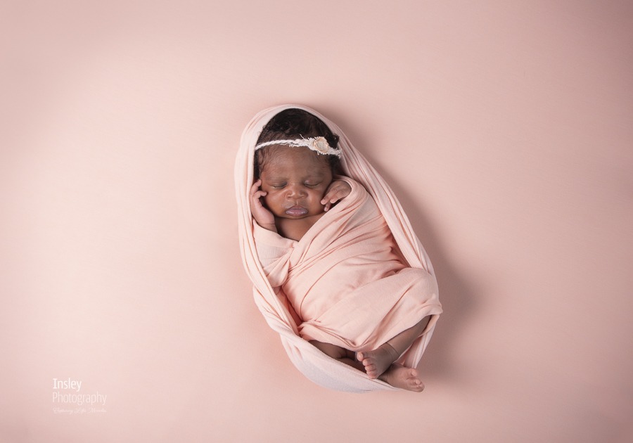 newborn baby girl fort mill newborn photographer, charlotte newborn photographer, baby black girl in pink wrap on pink backdrop, sweet & innocent,
