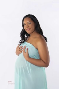 glowing with joy, expecting mother to be Charlotte, NC in aqua material