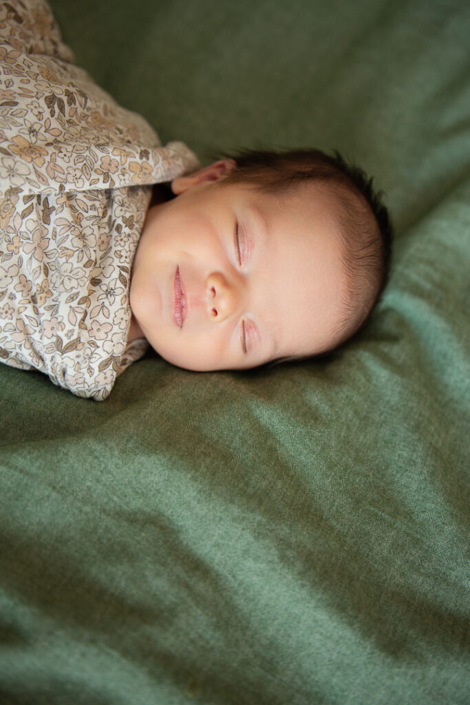 smirking baby girl captured by Insley Photography