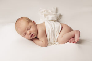 newborn boy portrait wrapped in white cloth created in Rock hill, SC